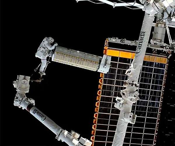 NASA performs spacewalk to install solar array on space station