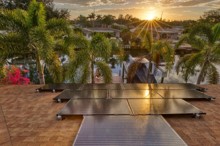 Solar panels on a residential house in Florida with the sun just starting to rise.